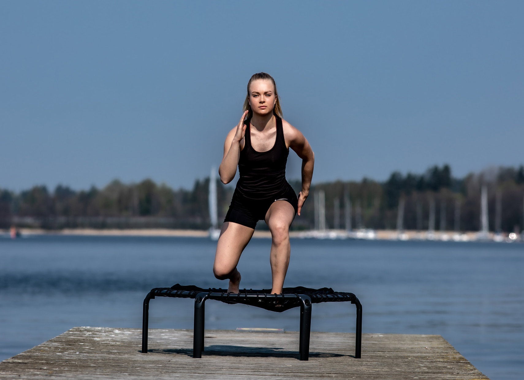 Premium Photo  Fitness jump and portrait of strong woman in